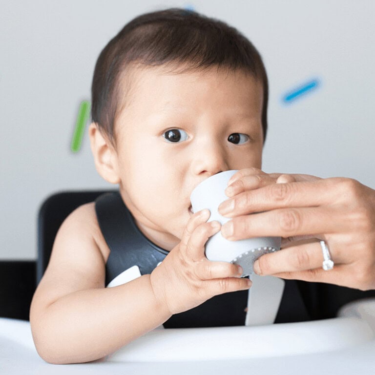 baby drink water from open cup