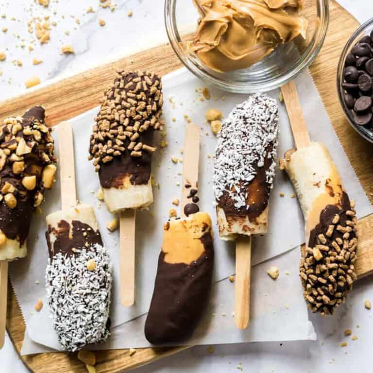 chocobananos with nutritious toppings - bran buds, coconut flakes, and chopped peanuts