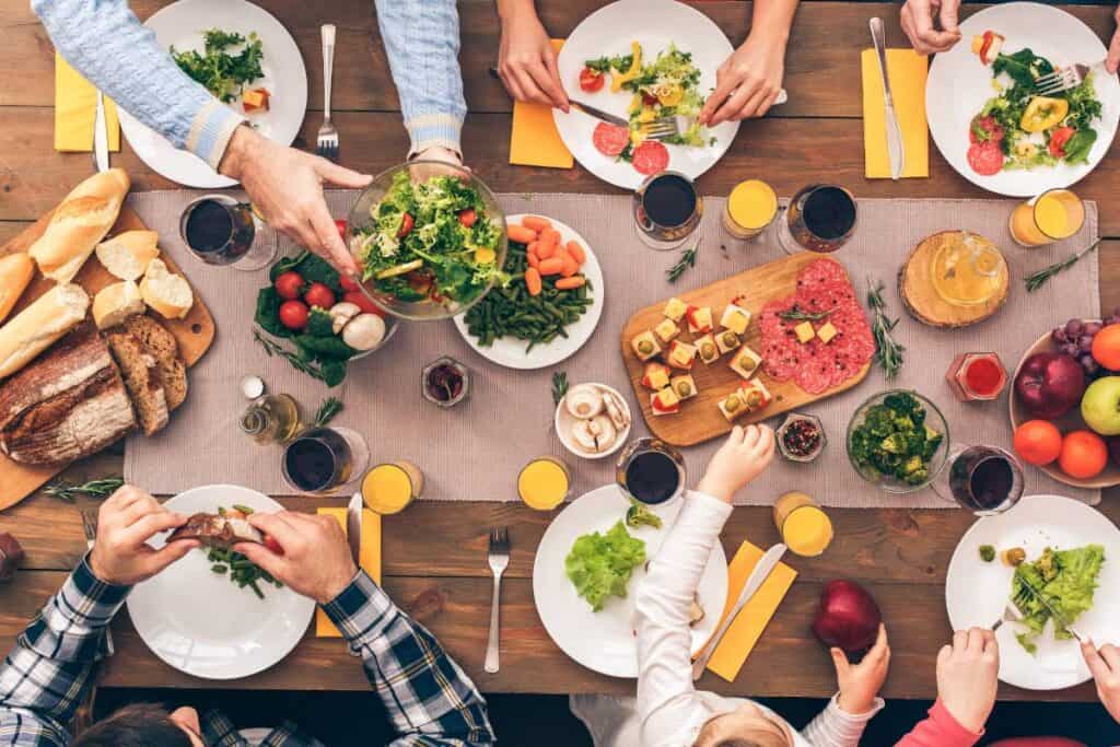 An overhead view of a family enjoying dinner.