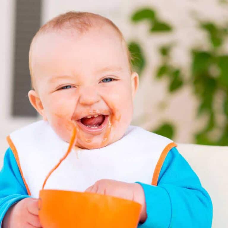 baby eating beans
